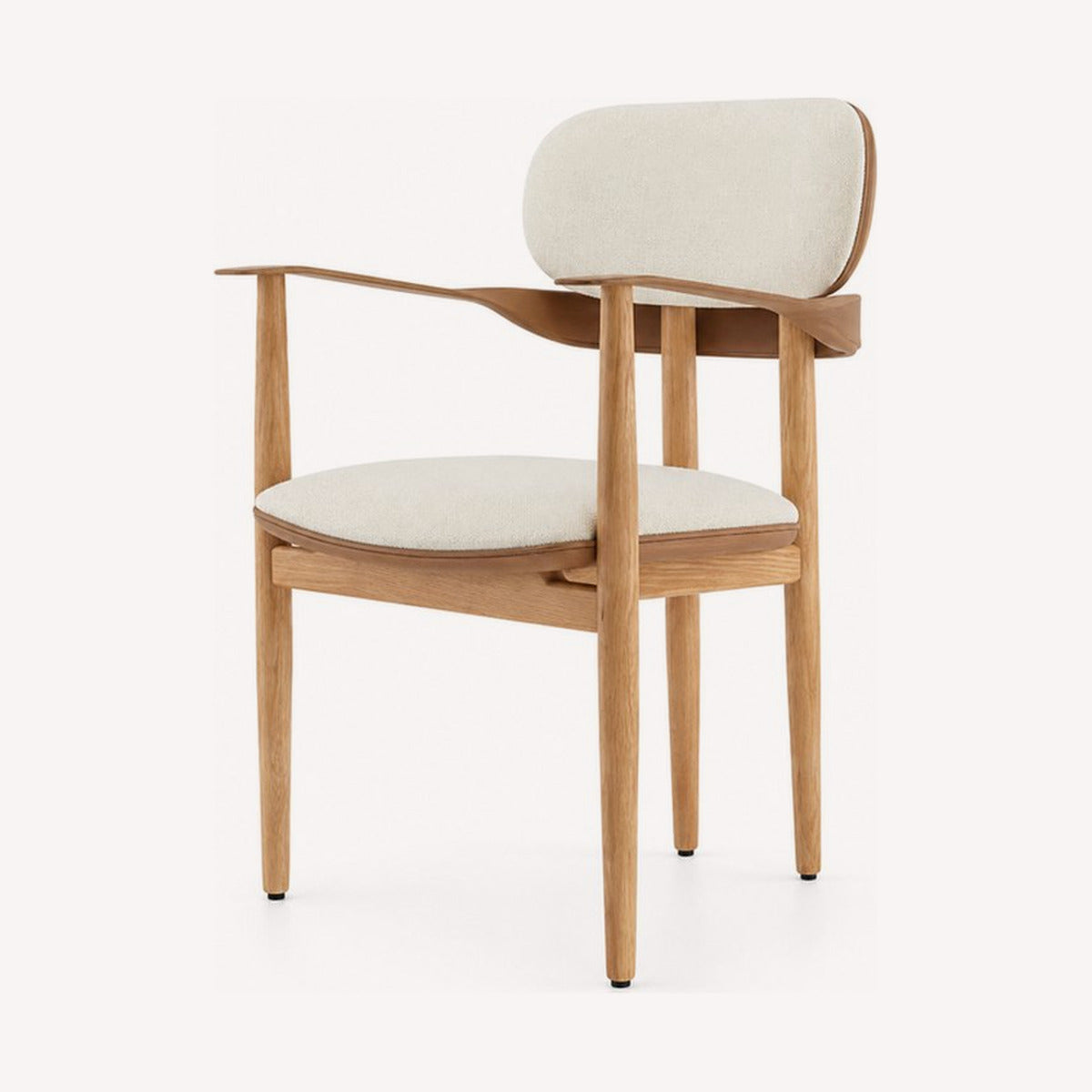 Upholstered dining chairs and armchairs in bouclé, velvet and vegan leather, built for long dinners.