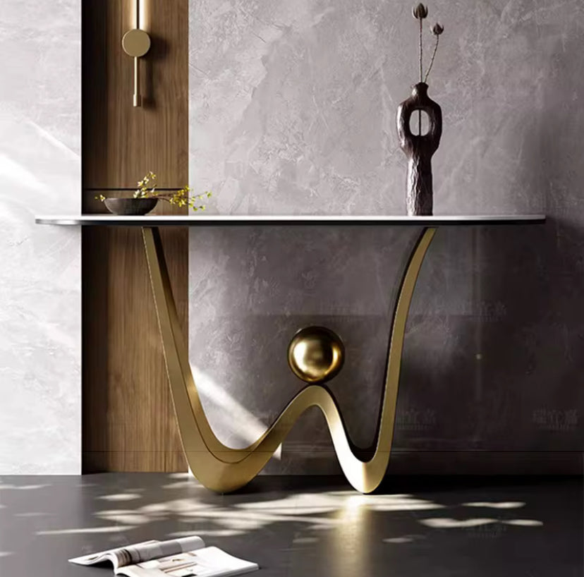 Golden wall mounted console with marble look top and bronze wave base, view 2