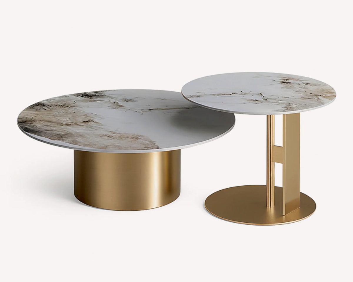 Golden pair of round granite tables on gold legs