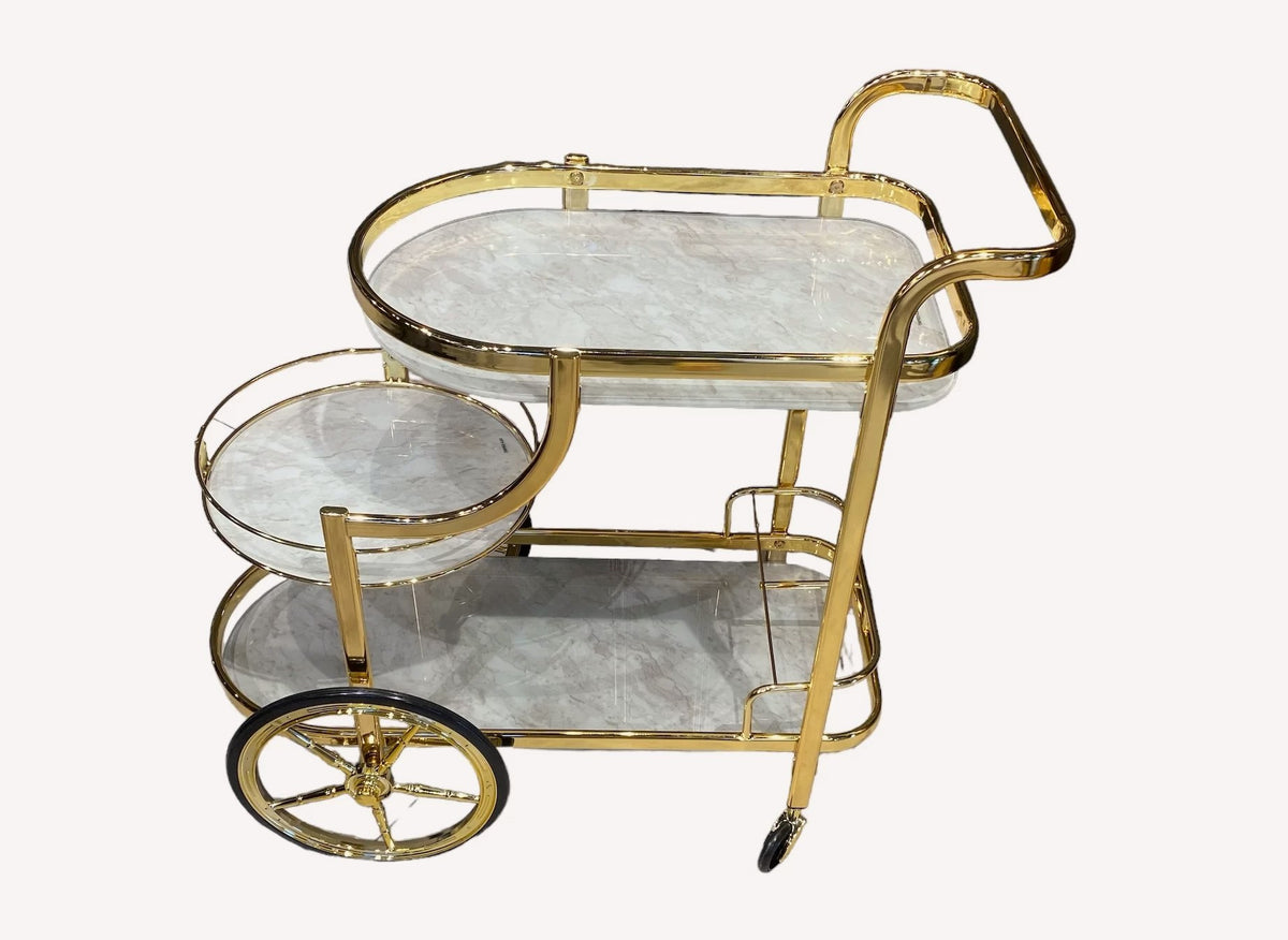 Gold bar cart with marble look shelves and spoked wheels