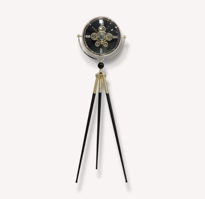 Yofi tripod floor clock with exposed gear face and gold accents