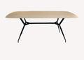 Ovali light top dining table on sculpted black metal base