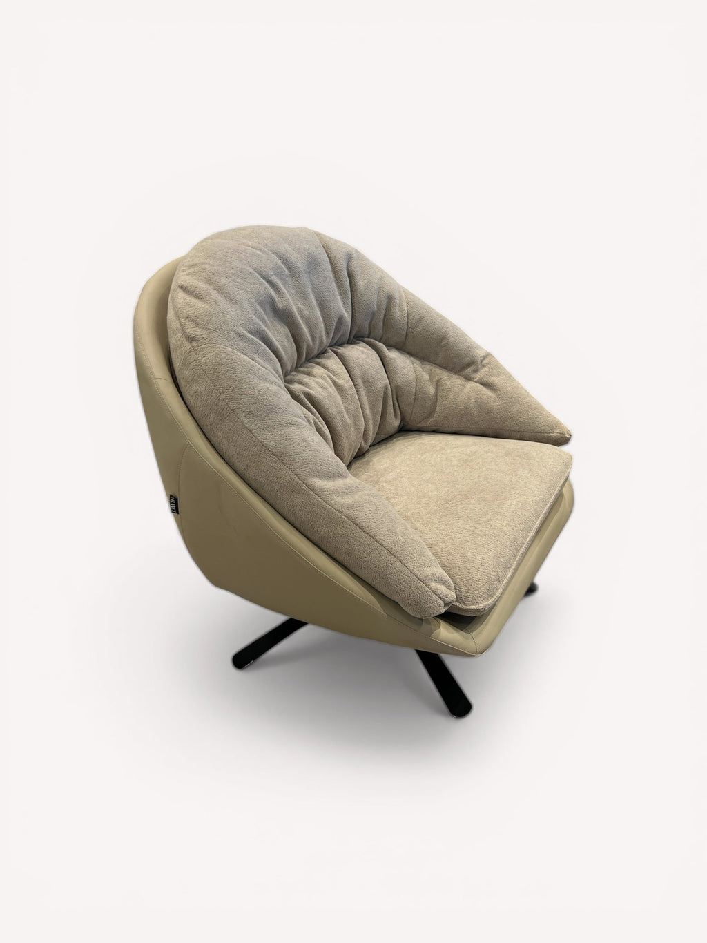 Marshmallow round swivel chair with leather shell and soft fabric interior
