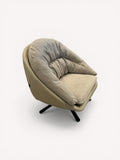 Marshmallow round swivel chair with leather shell and soft fabric interior
