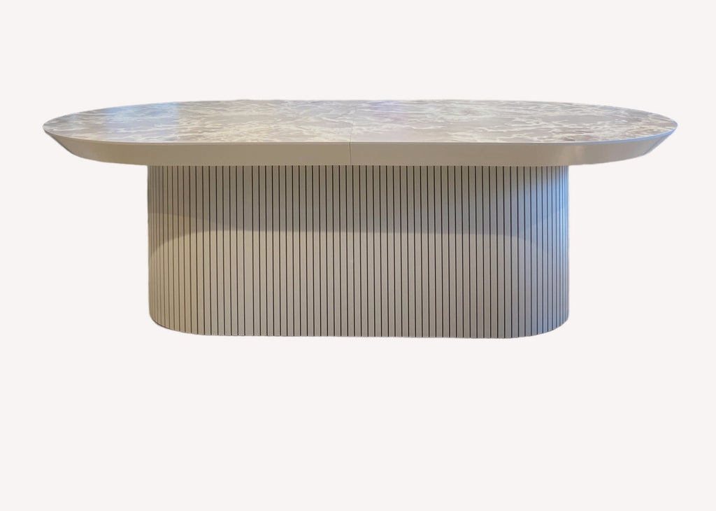 Star oval marble look dining table on fluted pedestal