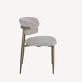 Dori upholstered dining chair with brushed bronze legs