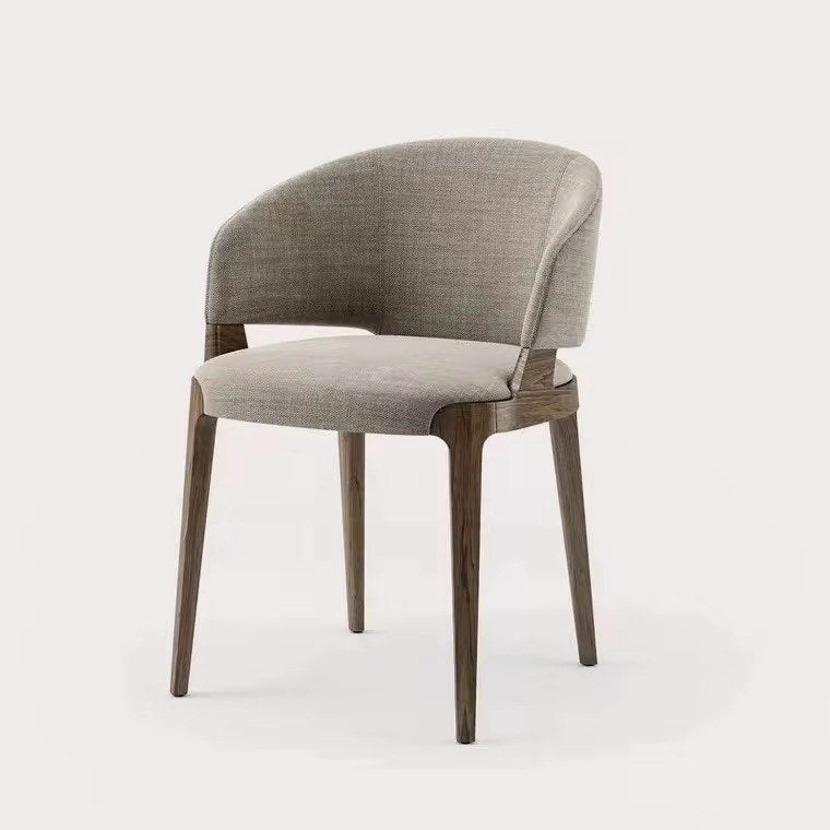 Sylvia dining chair with dark solid wood frame and rounded upholstered back