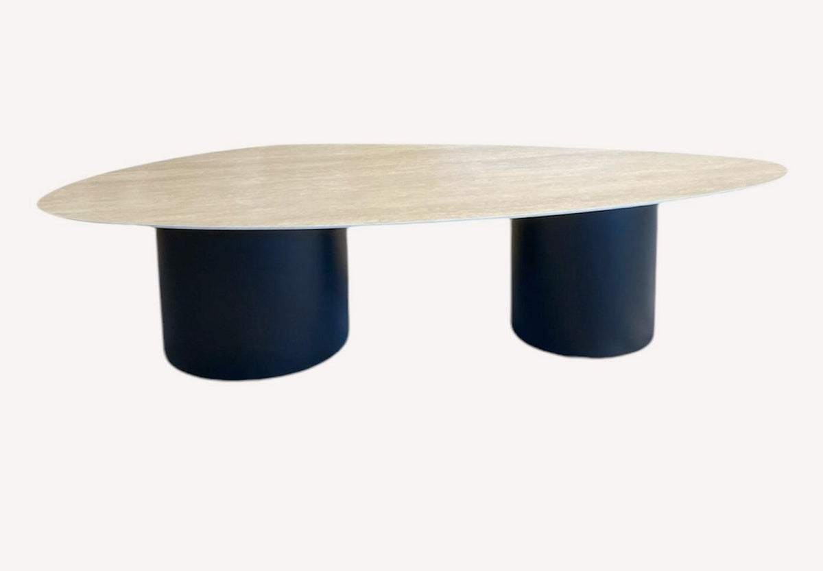 Tavor organic travertine look coffee table on navy cylinders