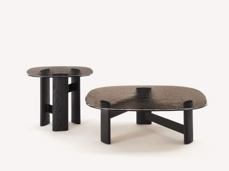 Noir coffee table with smoked glass top on black geometric wood base