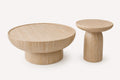 Pitria set of two round travertine-look tables at different heights