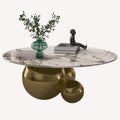 Hollywood oval marble look coffee table on polished gold sphere base