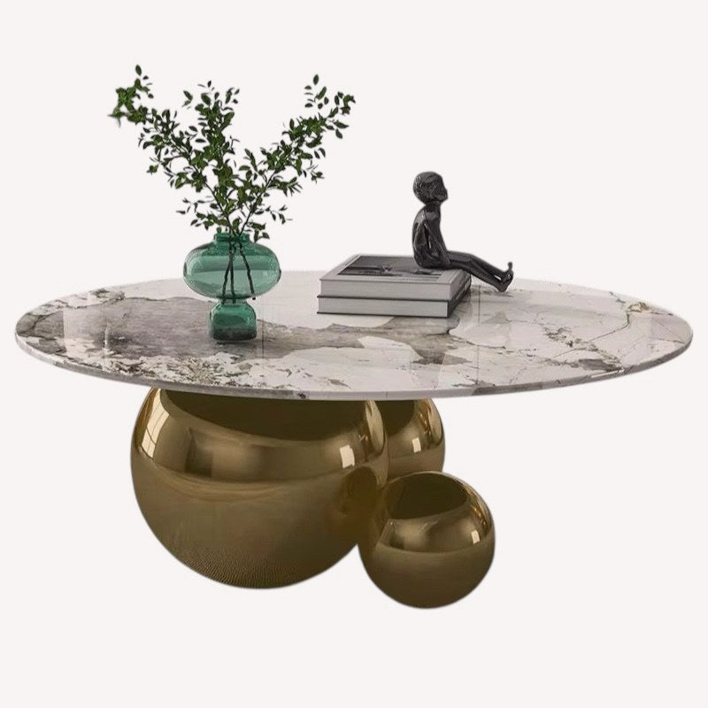 Hollywood oval marble look coffee table on polished gold sphere base