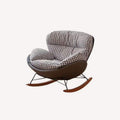 Marbella rocking lounge chair with houndstooth cushions and dark shell