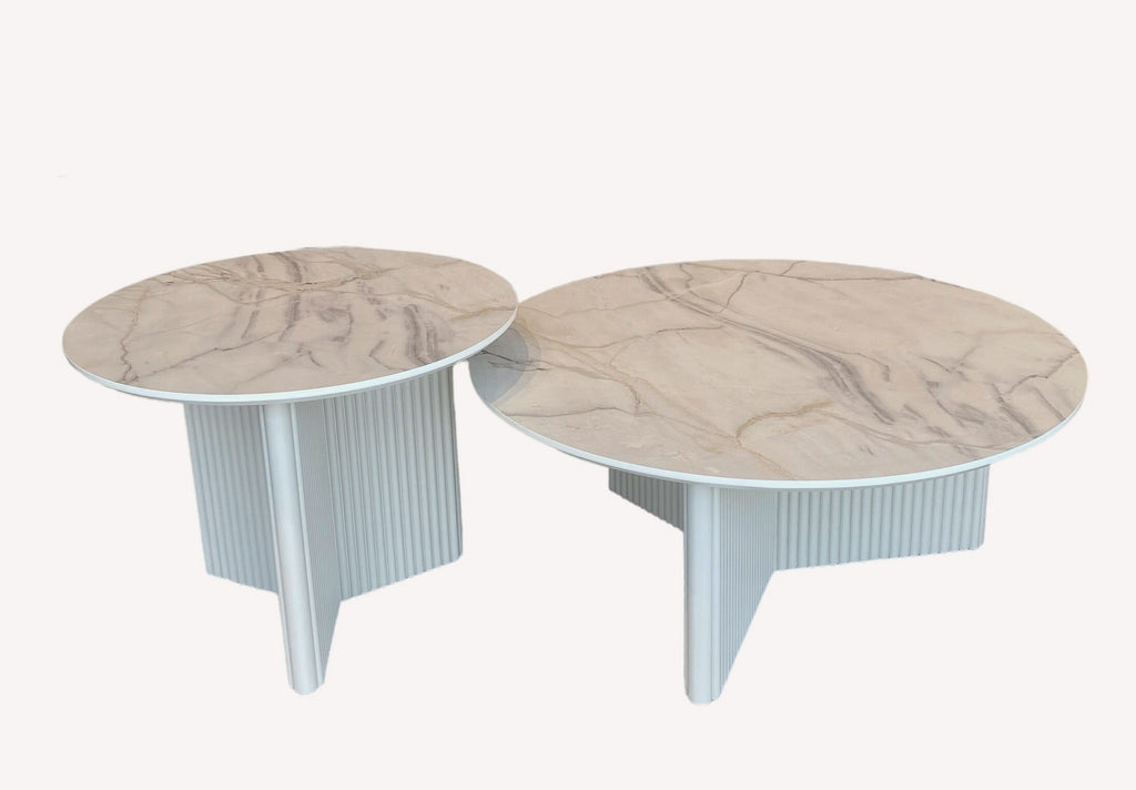 Diamond pair of round marble look tables on fluted white bases