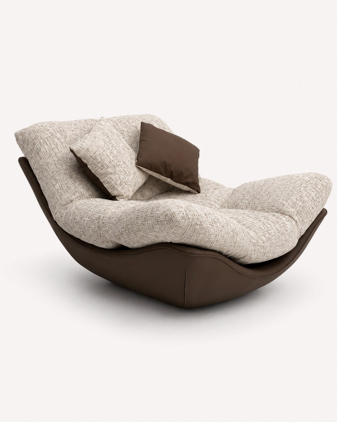 Nido sculptural accent chair with plush seat in a rounded dark shell