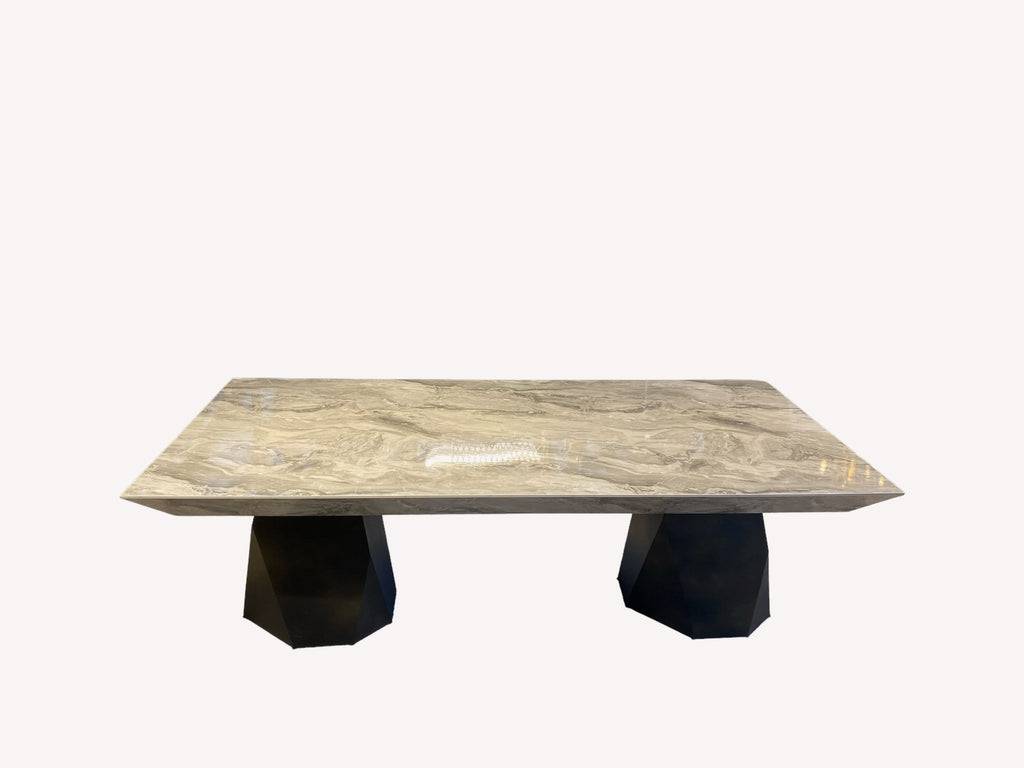Discovery marble look dining table on faceted black pedestals