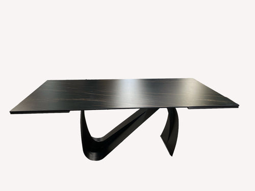 Busto black porcelain dining table on sweeping black base