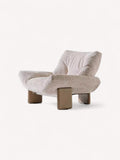 Emmi sculptural accent chair on stainless steel base
