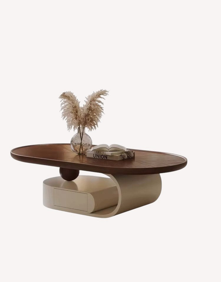 Queen oval walnut coffee table on curved cream base with drawer