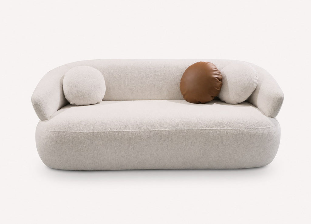 Mila 76 inch curved sofa with round bolsters in woven fabric
