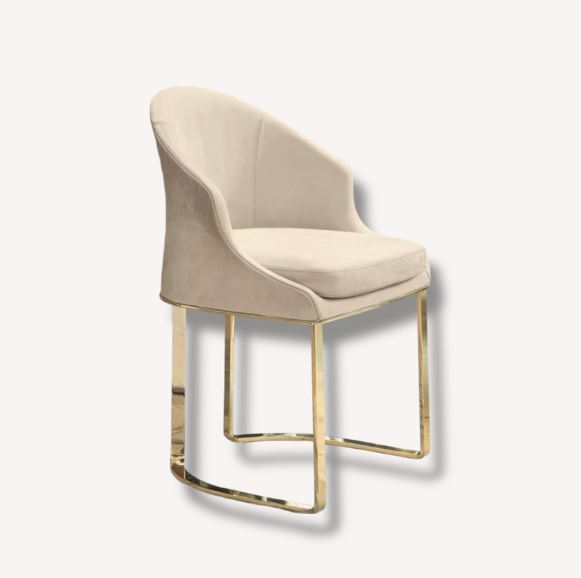 Andrea beige curved dining chair with polished gold sled legs