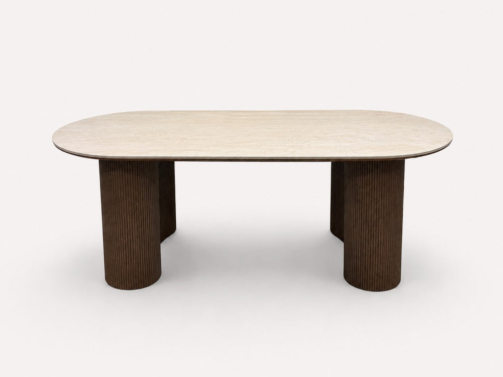 Yavan organic dining table with travertine-tone top on fluted walnut base