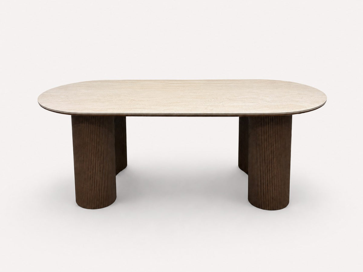 Yavan organic dining table with travertine-tone top on fluted walnut base