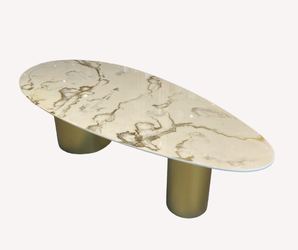 Kinder oval epoxy coffee table with gold veining on gold cylinders