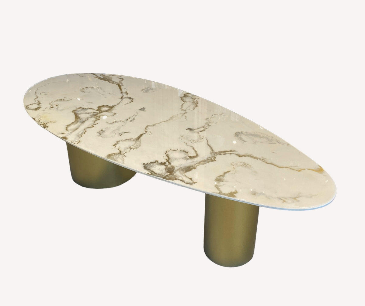 Kinder oval epoxy coffee table with gold veining on gold cylinders