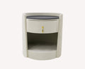 Weekend rounded cream quilted nightstand with black top and gold pull