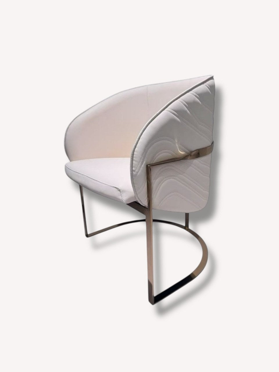 Leventra ivory quilted dining armchair on bronze sled frame