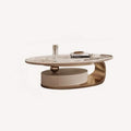 Golden oval porcelain coffee table on sweeping rose gold base with drawer