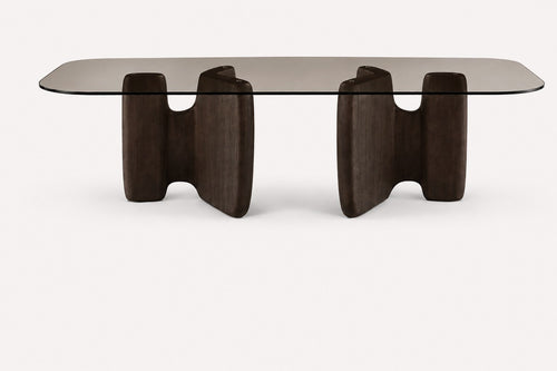 Adam XL long smoked glass dining table on two sculptural wood bases