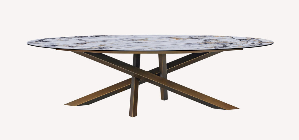 Oliver oval marble look porcelain dining table on crossed bronze base