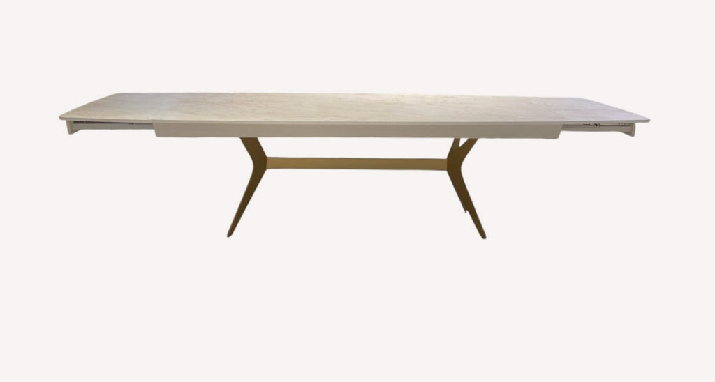 Bell dining table with light top and angled bronze legs, view 2