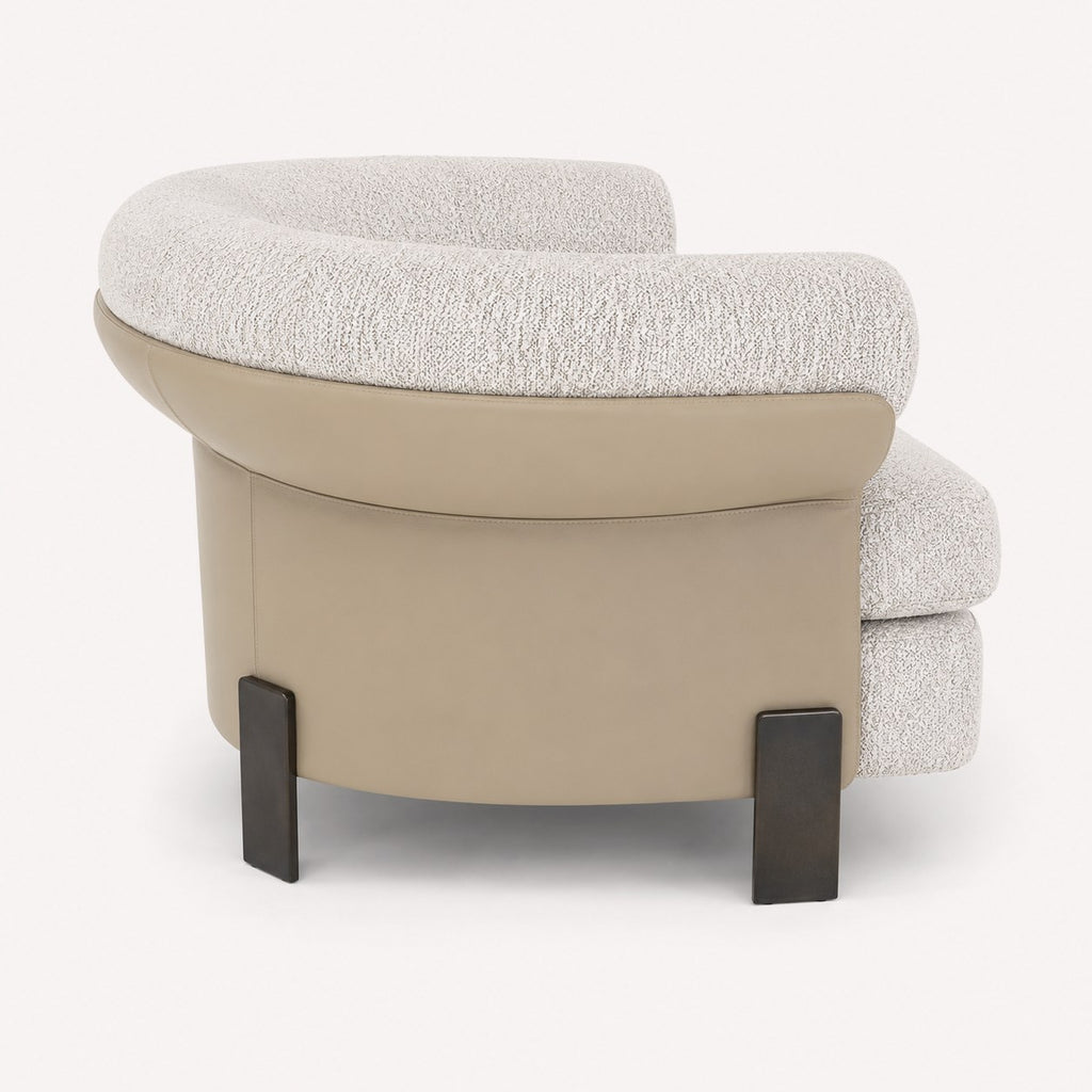 Aristo rounded accent chair with leather exterior and metal legs, view 2