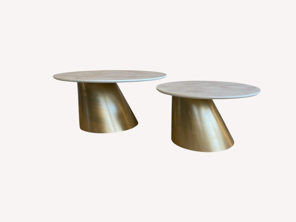 Keren pair of round marble look tables on slanted gold cone bases, view 2