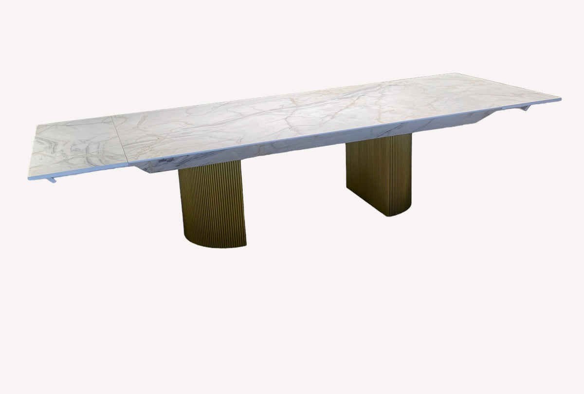 King marble look dining table on fluted gold pedestals, view 2