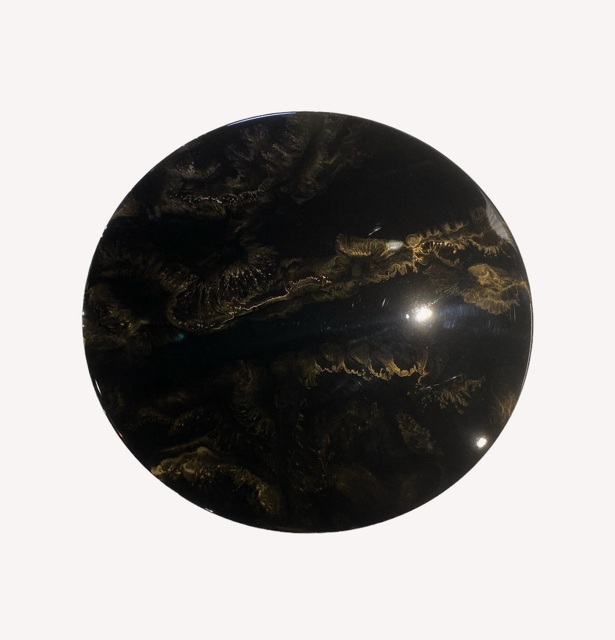 Black glossy round liquid marble coffee table on tapered pedestal, view 2