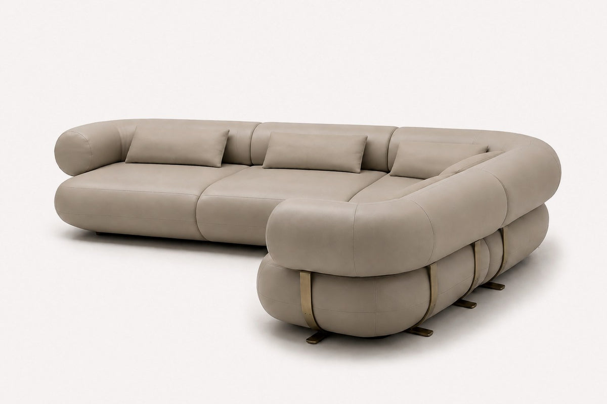 Aristo curved sectional in vegan leather with brass-tone base details, view 2