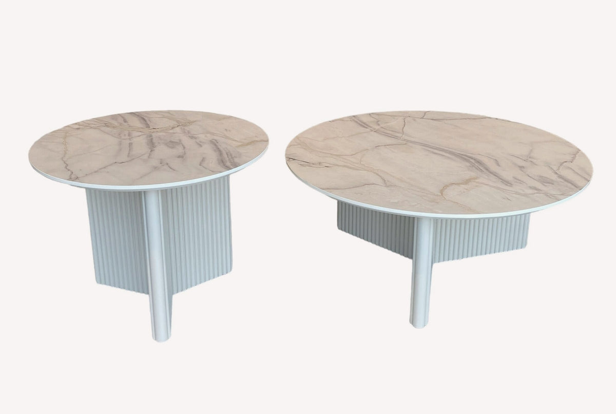Diamond pair of round marble look tables on fluted white bases, view 2