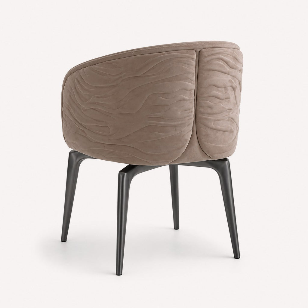 Hadar dining chair with 3D textured upholstery and dark metal legs, view 2