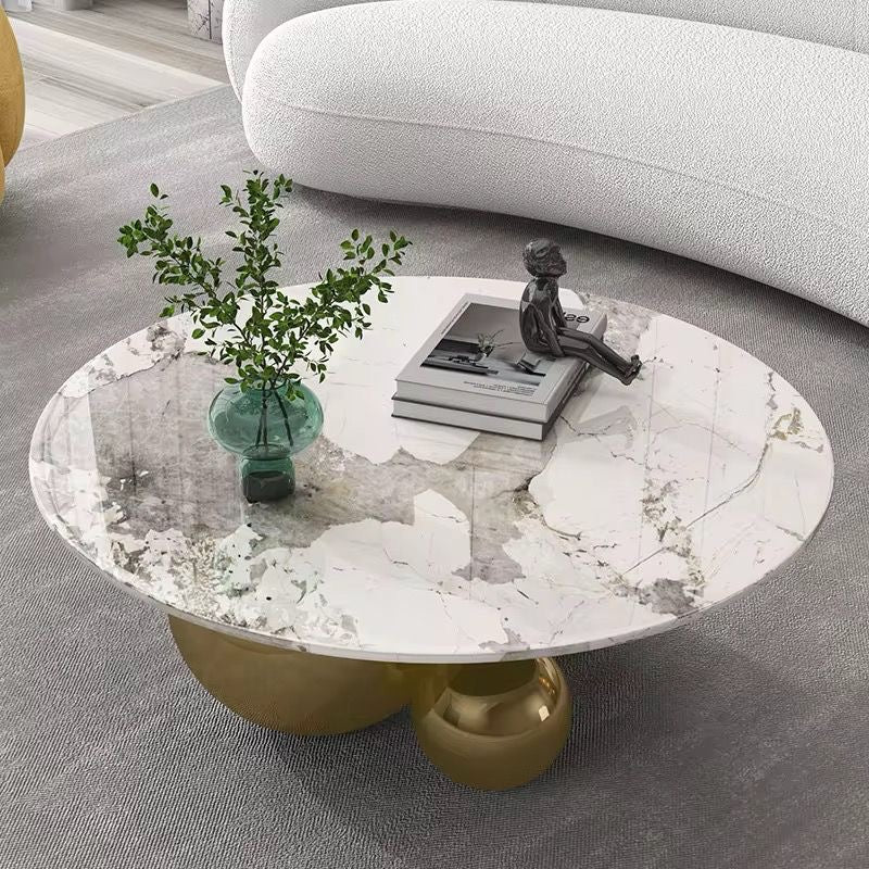 Hollywood oval marble look coffee table on polished gold sphere base, view 2