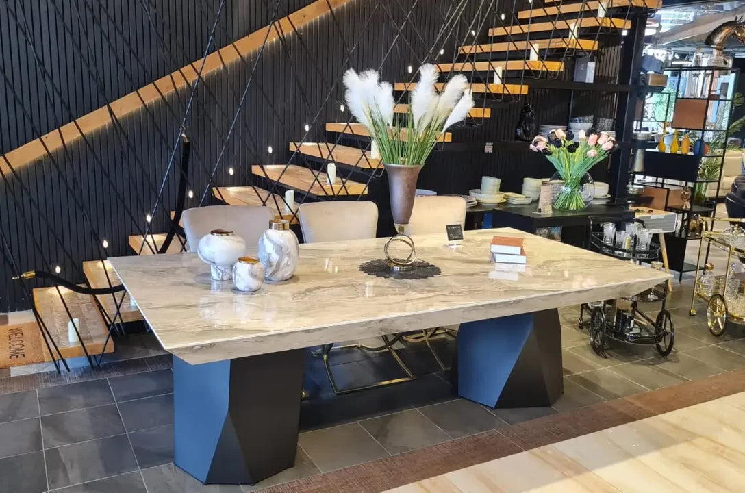 Discovery marble look dining table on faceted black pedestals, view 2