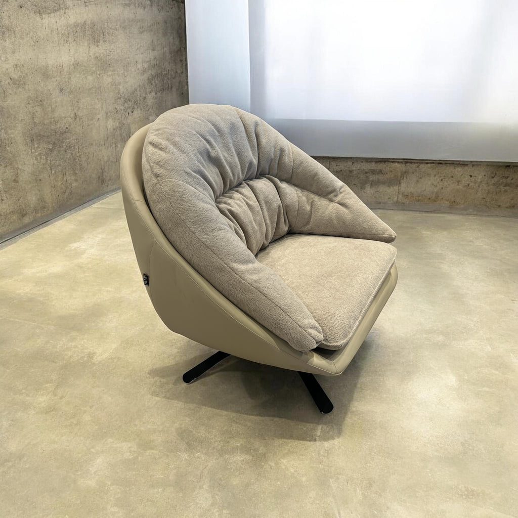 Marshmallow round swivel chair with leather shell and soft fabric interior, view 3